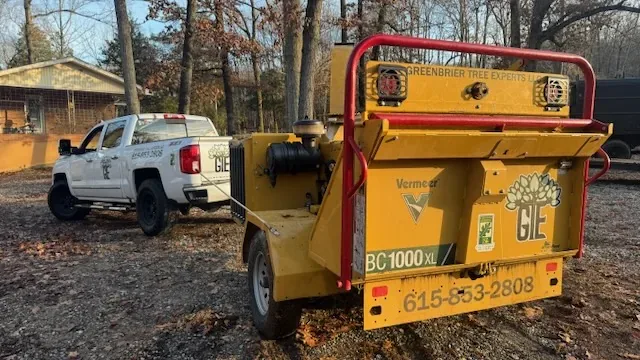 Greenbrier Tree Experts chipper and company truck on a job site