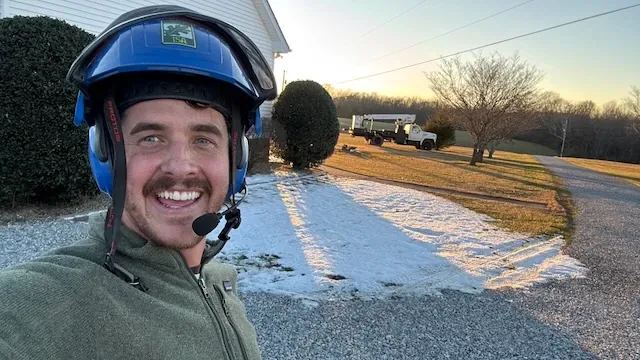 Gabe Thompson smiling on a jobsite driveway