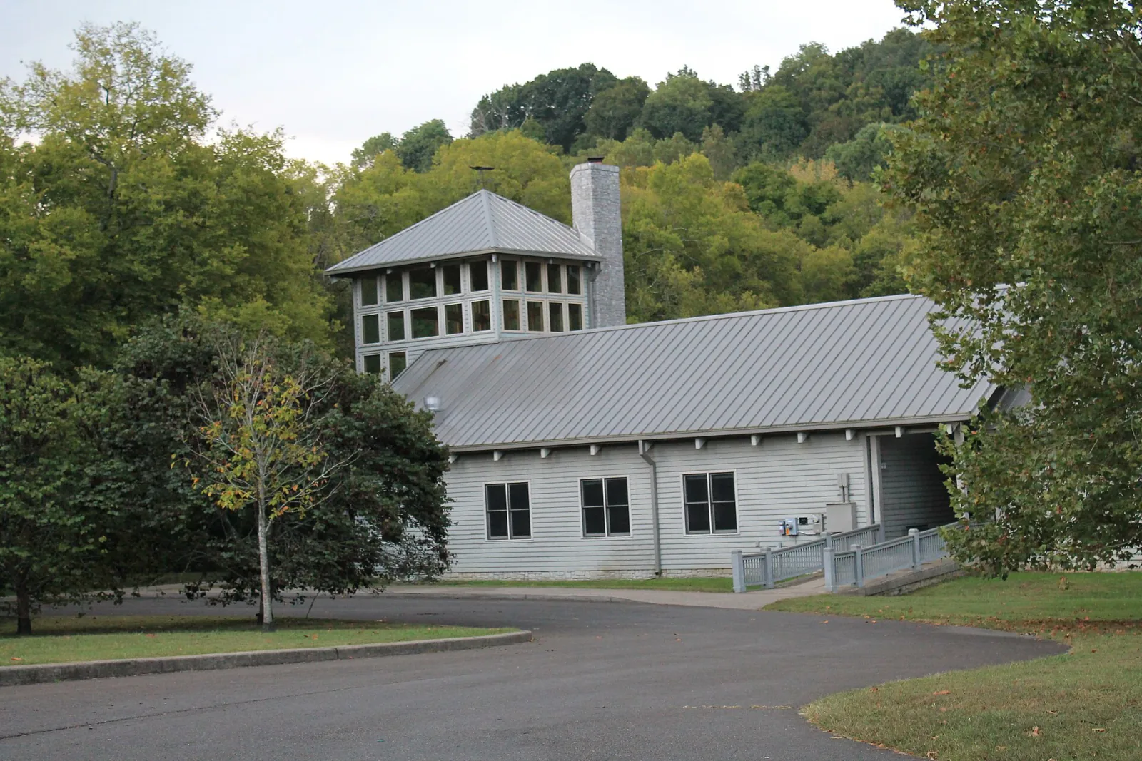 Warner Park Nature Center framed by leafy trees and wooded hills near Bellevue in Nashville, Tennessee
