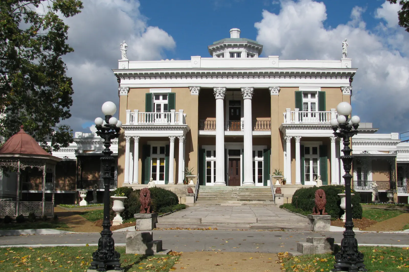 The columned front of Belmont Mansion framed by trees on the Belmont University campus in Nashville, Tennessee