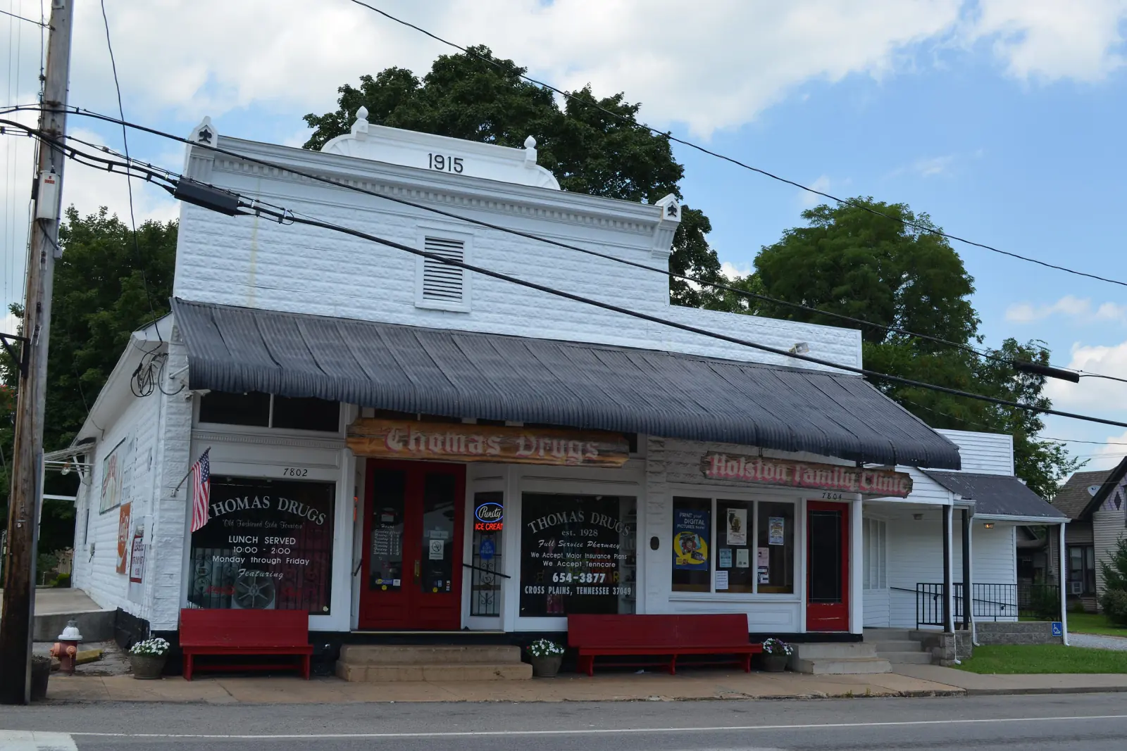 The 1915 Thomas Drugs storefront with its red awnings on the main street of Cross Plains, Tennessee