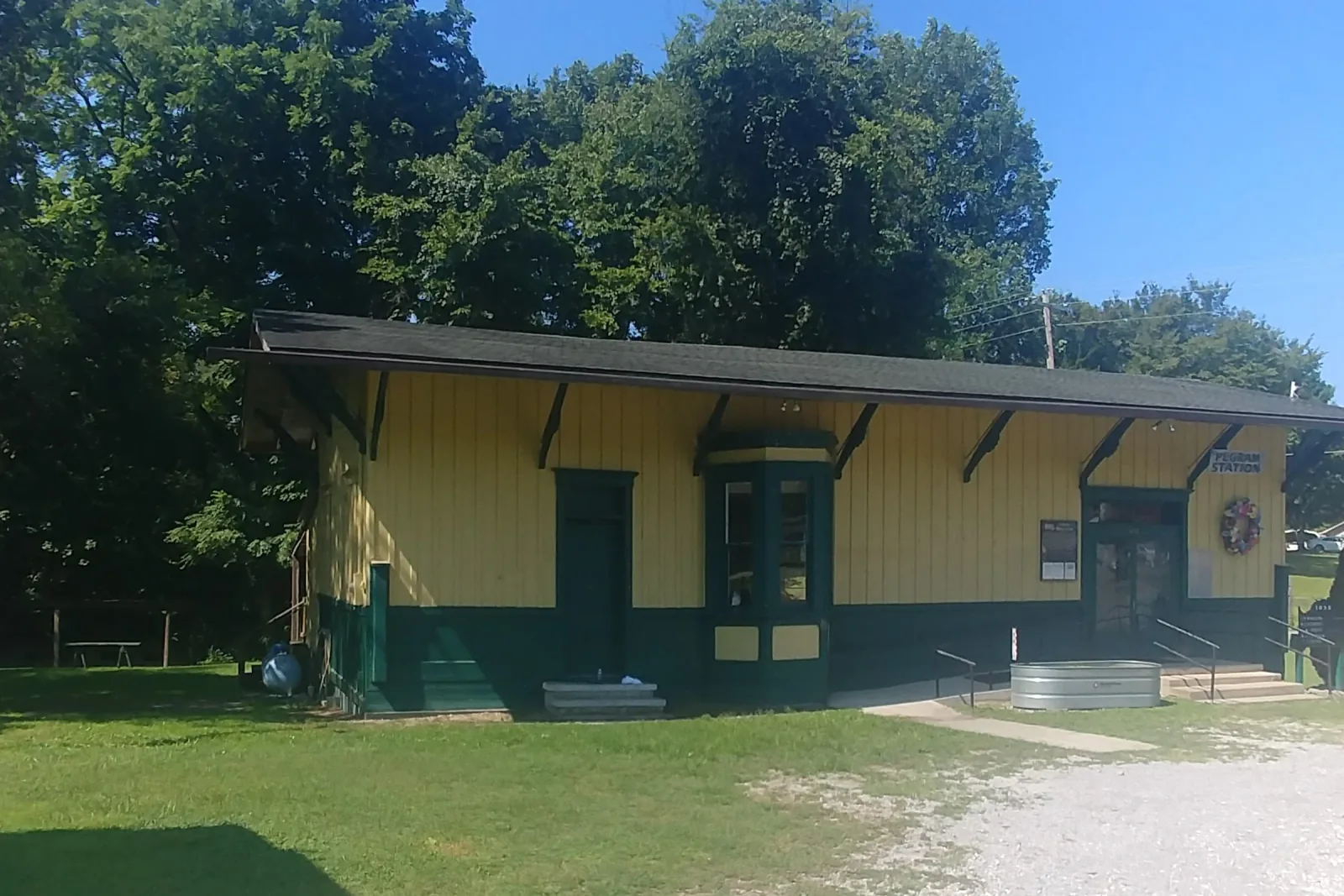 The restored yellow and green Pegram Station railroad depot in Pegram, Tennessee